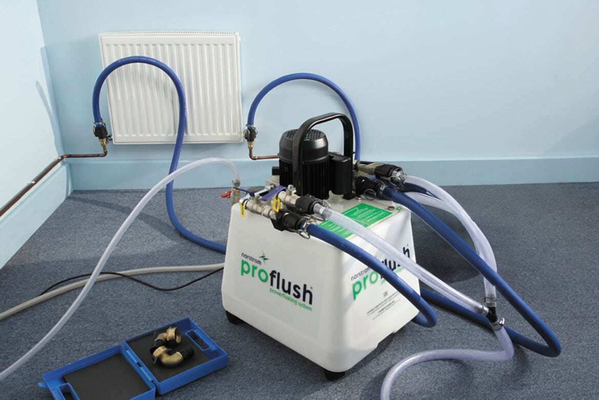 Power flush machine connected to central heating